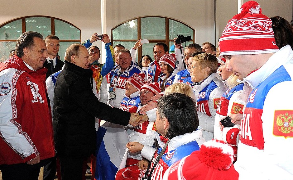 With members of the Russian Paralympics team after the Russian Federation flag-raising ceremony at the Paralympic Mountain Village. Sports Minister Vitaly Mutko, left.