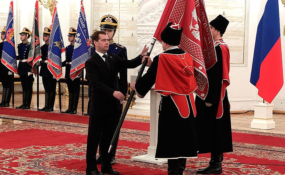 Presenting banners to Cossack military societies. Dmitry Medvedev presents the banner of Kuban Cossack military society to ataman Nikolai Doluda.