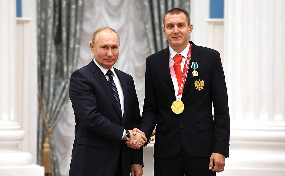 Presenting state decorations to winners of the 2020 Summer Paralympic Games in Tokyo. Paralympic athletics champion Anton Kulyatin receives the Order of Friendship.