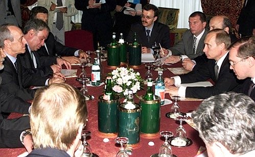 President Vladimir Putin meeting with Vittorio Mincato, CEO of the ENI oil and gas company.