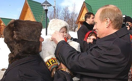 President Putin visiting an outdoor ethnography site.