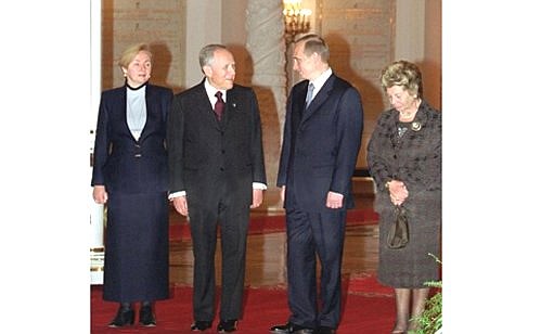 President Vladimir Putin and his Italian counterpart Carlo Azeglio Ciampi with their wives during a welcoming ceremony.