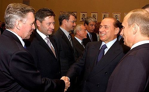President Putin introducing members of the Russian delegation-Education Minister Vladimir Filippov and Minister of Information Technology and Communications Leonid Reiman-to Italian Prime Minister Silvio Berlusconi before expanded Russian-Italian talks.