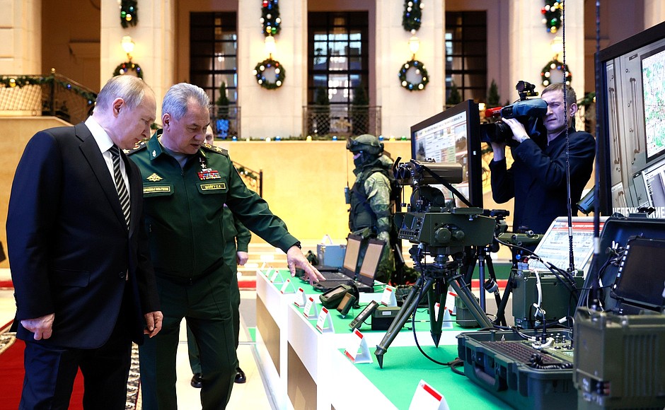With Defence Minister Sergei Shoigu at the theme exhibition dedicated to the Defence Ministry Board’s final meeting in 2021.