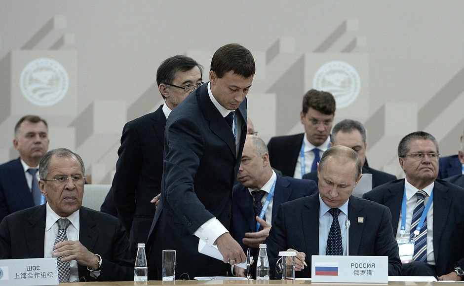 Signing documents following the summit of the Shanghai Cooperation Organisation Council of Heads of State.