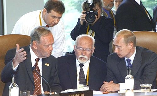 A meeting of the G8 heads of state and government. President Vladimir Putin with Canadian Prime Minister Jean Chretien.