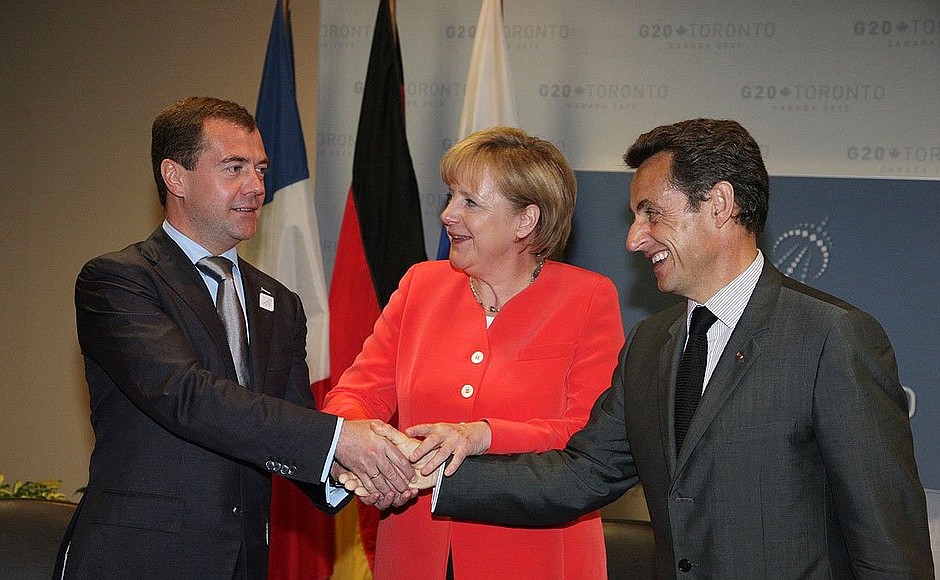 With Federal Chancellor of Germany Angela Merkel and President of France Nicolas Sarkozy.