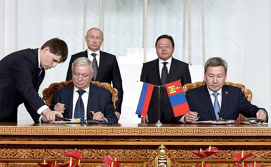 Signing bilateral agreements following Russian-Mongolian talks.