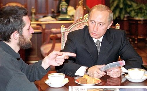 President Putin meeting the French photojournalist Brice Fleutiaux, who was freed by Russian security forces from Chechen captivity.