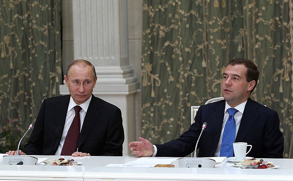 With Prime Minister Vladimir Putin at the meeting with pensioners and veterans.
