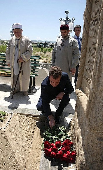 Laying flowers at the grave of First President of Chechnya Akhmat Kadyrov.