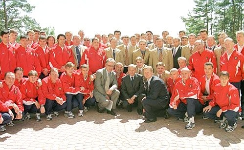President Putin with the players of the Russian football and ice hockey teams.