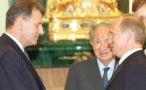 President Putin with a new president of the International Olympic Committee, Jacques Rogge (left), and the honorary president of the same committee, Juan Antonio Samaranch.