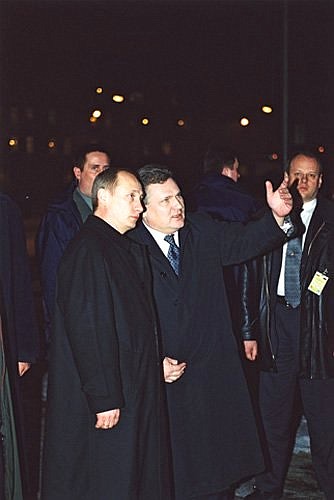 President Putin with Polish President Alexander Kwasniewski strolling across the city.