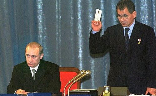 Vladimir Putin at the founding congress of Yedinstvo I Otechestvo (Unity and Motherland) Party with the party\'s co-chairman Sergei Shoigu.
