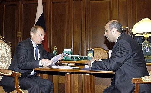 President Putin meeting with Energy Minister Igor Yusufov.