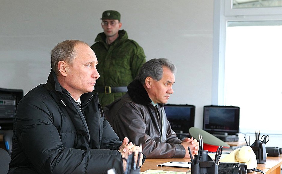 Vladimir Putin observes military exercises in the Black Sea region with Defence Minister Sergei Shoigu.