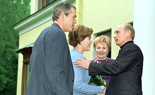 President Vladimir Putin and his wife, Lyudmila, during a meeting with US President George Bush and his wife, Laura.
