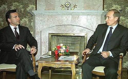 President Putin with Italian Foreign Minister Franco Frattini.