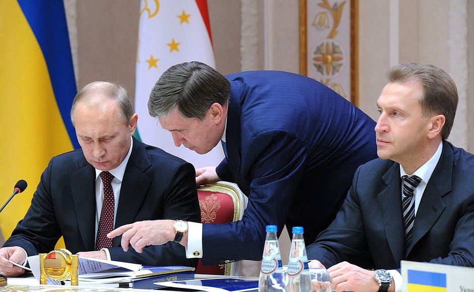 With Presidential Aide Yury Ushakov and First Deputy Prime Minister Igor Shuvalov (right) at a meeting of the Supreme Eurasian Economic Council.
