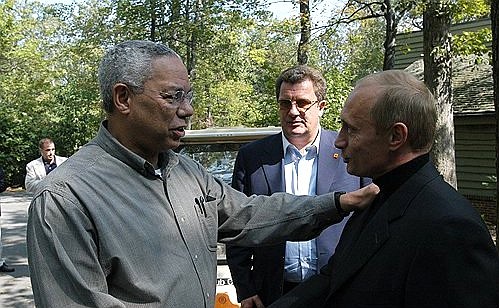 President Putin with US Secretary of State Colin Powell. In the background — Sergei Prikhodko, aide to the Russian President.