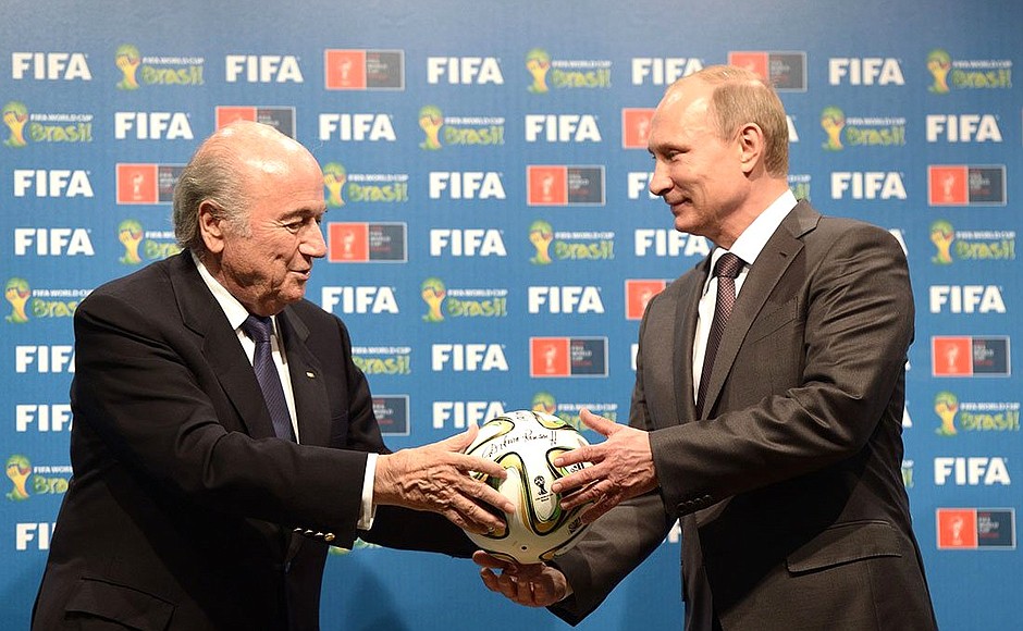 With FIFA President Joseph Blatter at the ceremony handing over the FIFA World Cup host country rights from Brazil to Russia.