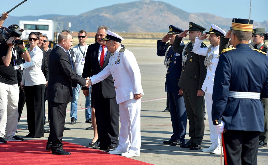 Vladimir Putin arrives on a visit to Greece.