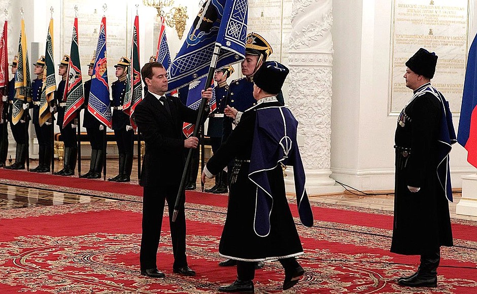 Presenting banners to Cossack military societies. Dmitry Medvedev presents the banner of Terek Cossack military society to ataman Vasily Bondarev.