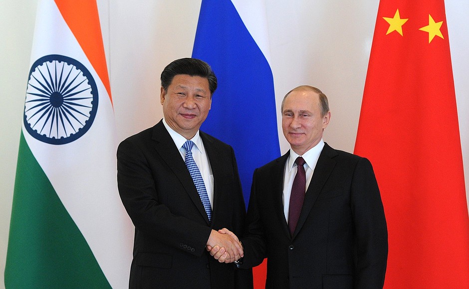 Before the start of an informal meeting of the BRICS leaders. With President of China Xi Jinping.
