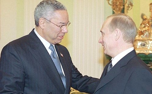 Vladimir Putin with US Secretary of State Colin Powell.