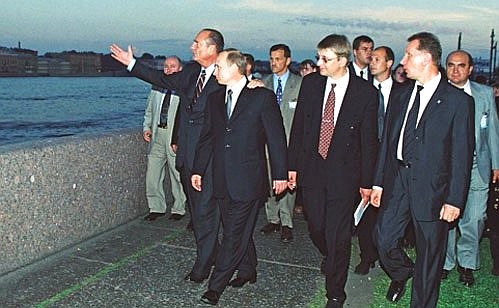 President Vladimir Putin and French President Jacques Chirac taking a walk along the Neva River.