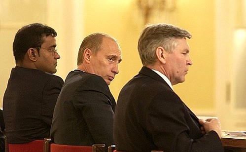 President Putin with Education Minister Vladimir Filippov and President Bharrat Jagdeo of Guyana at the World Forum of Foreign Graduates of Russian (Soviet) Higher Education Institutions.