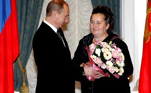 Ceremony presenting state awards. A mother of many children, Galina Chuvilkina, received a Friendship Award.