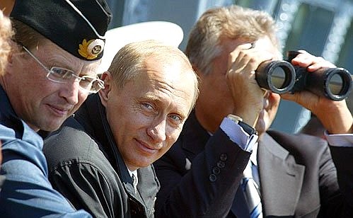 President Putin on board the missile cruiser Marshal Ustinov with Polish President Alexander Kwasniewski and Russian Defence Minister Sergei Ivanov (left) during the tactical exercises of the Baltic and Northern Fleets.