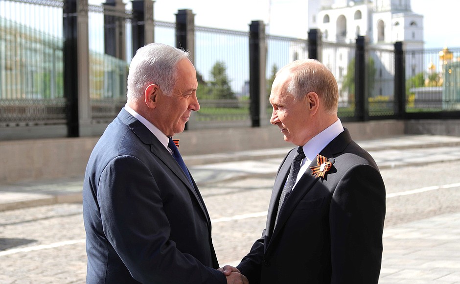 With Prime Minister of Israel Benjamin Netanyahu before the military parade marking the 73rd anniversary of Victory in the 1941–45 Great Patriotic War.