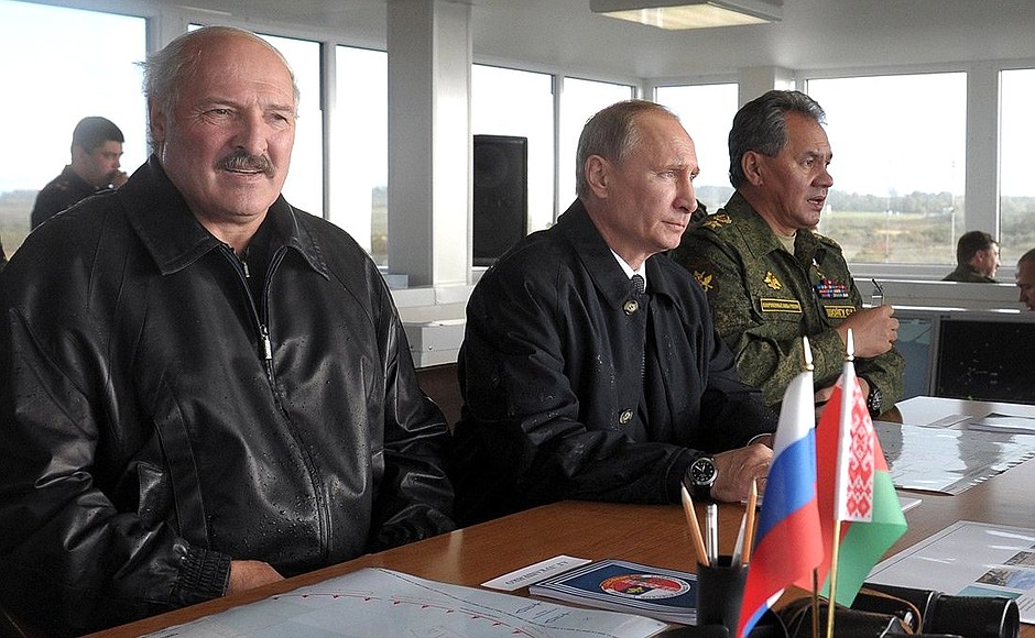 At the Khmelyovka test ground during the final stage of the Zapad-2013 Russian-Belarusian strategic military exercises. With Belarusian President Alexander Lukashenko and Defence Minister Sergei Shoigu.