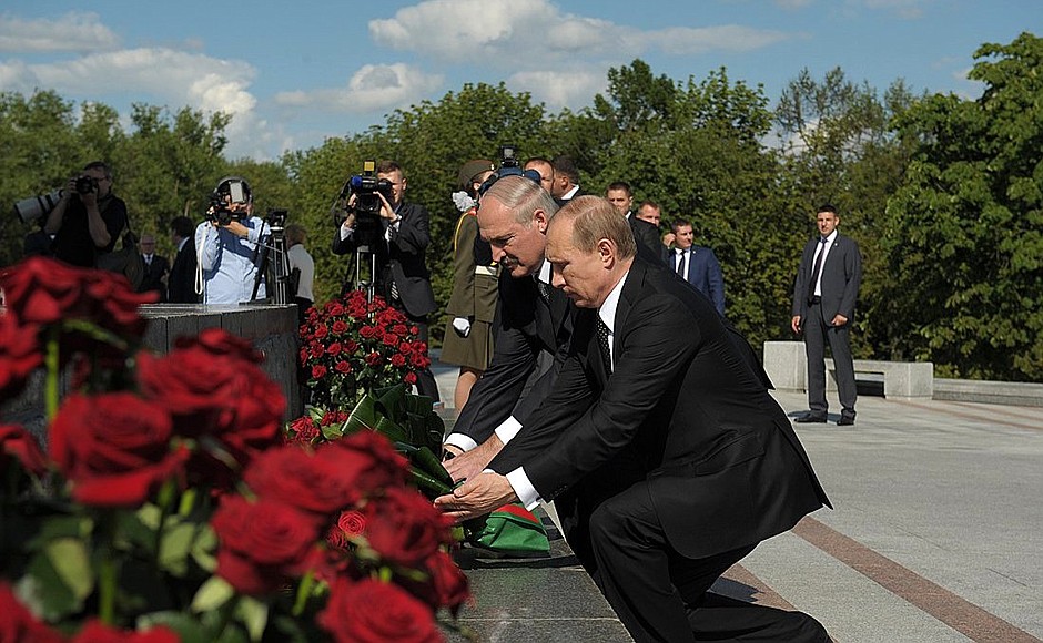 Laying flowers at the Hero City of Minsk monument. With President of Belarus Alexander Lukashenko.