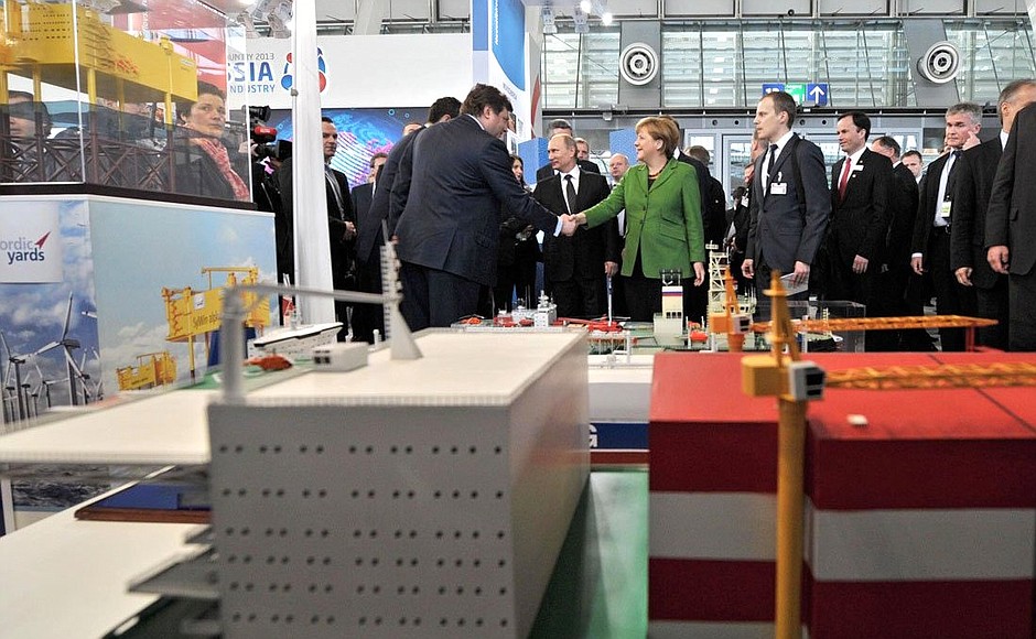 At the Russian pavilion at the Hannover Messe 2013. With German Federal Chancellor Angela Merkel.