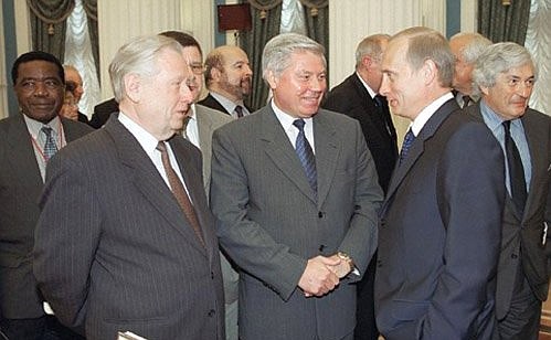 Meeting delegates to the 2nd Global Justice Conference. President Putin with Supreme Court Chairman Vyacheslav Lebedev and Constitutional Court Chairman Marat Baglai (left).