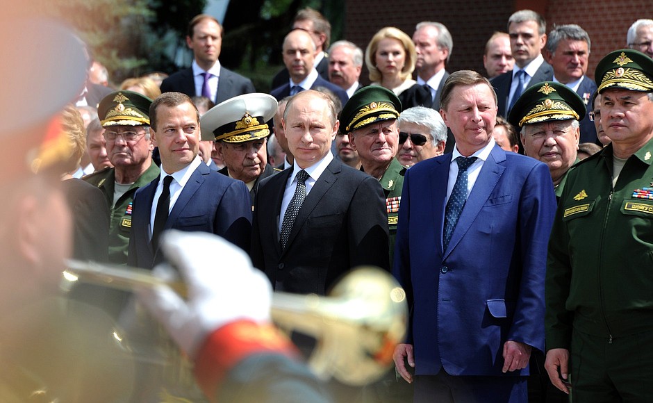 At a wreath-laying ceremony at the Tomb of the Unknown Soldier by the Kremlin wall. With Prime Minister Dmitry Medvedev, Chief of Staff of the Presidential Executive Office Sergei Ivanov and Defence Minister Sergei Shoigu.