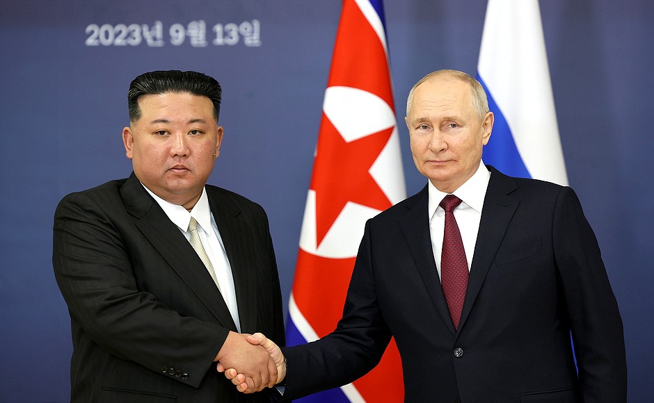 С Председателем Государственных дел КНДР Ким Чен Ыном.