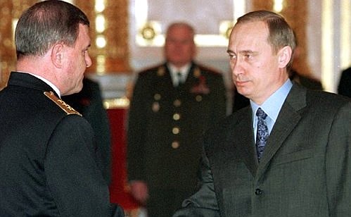 Mr Putin presented the epaulets of fleet admiral to Vladimir Kuroyedov.
