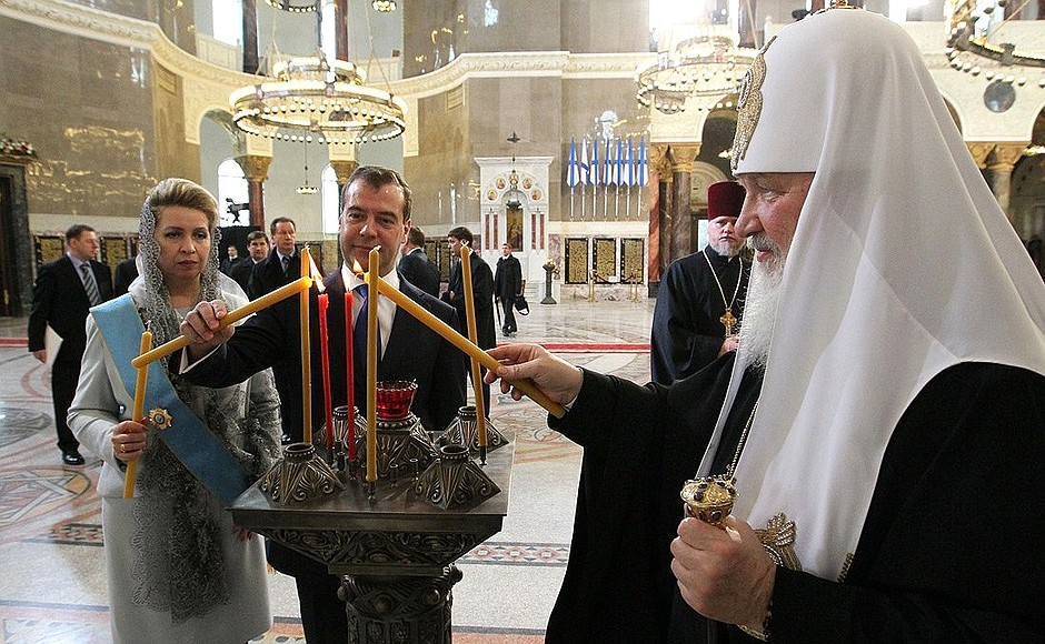 Dmitry and Svetlana Medvedev with Patriarch Kirill of Moscow and All Russia at the Naval Cathedral of Saint Nicholas in Kronstadt.
