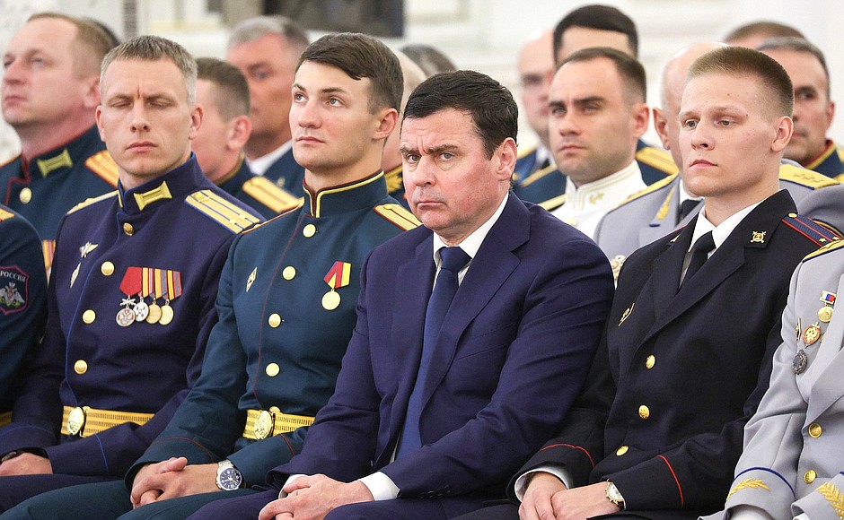 During a meeting with graduates of higher military schools. Aide to the President Dmitry Mironov (centre).
