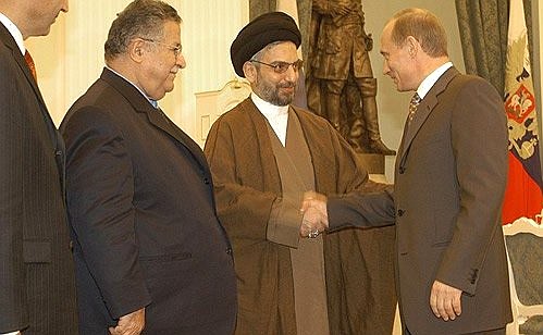 Vladimir Putin meeting head of the Provisional Governing Council of Iraq Abdel Aziz al-Hakim.