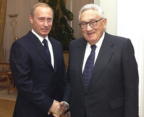 President Putin meeting with former Secretary of State Henry Kissinger.