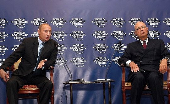 President Putin with World Economic Forum President Klaus Schwab during a forum meeting in Moscow.