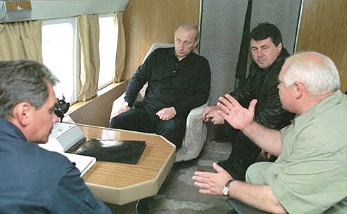 President Putin onboard a helicopter inspection flight over the Stavropol regions damaged by the snowmelt floods. The President is accompanied by Minister of Emergencies Sergei Shoigu (left), Governor of the Stavropol Region Alexander Chernogorov and the President\'s plenipotentiary representative in the Southern Federal District Viktor Kazantsev (right).