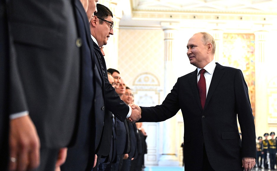 Vladimir Putin is welcomed by President of Kazakhstan Kassym-Jomart Tokayev in an official ceremony.