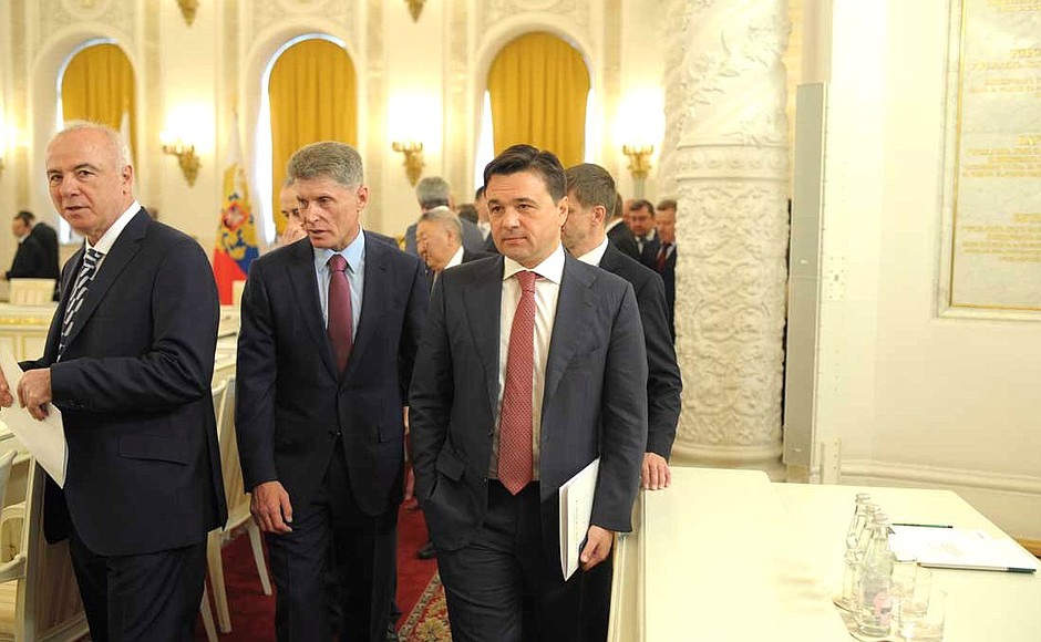 Head of the Republic of Adygea Aslan Tkhakushinov, Amur Region Governor Oleg Kozhemyako, Moscow Region Governor Andrei Vorobyov before the beginning of a joint meeting of the State Council and the Presidential Council for the Implementation of Priority National Projects and Demographic Policy.